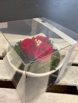 Preserved spray rose in a ceramic dish